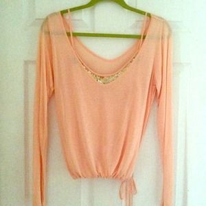 Long slv peach top with sequin neckline.