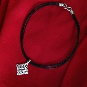 Black necklace w/silver pendant