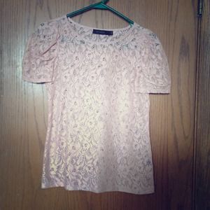 Light pink lace/like blouse. Cupped short sleeves.