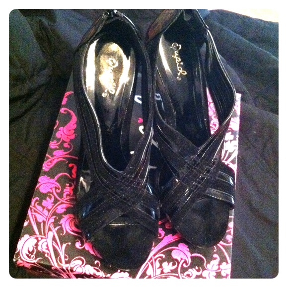 Cute Black strapped heels very good condition.