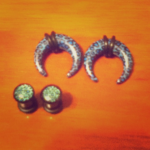 A set of blue leopard print gauges and plugs.