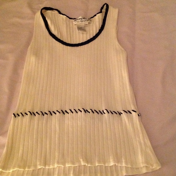 Creme colored sweater with black braiding on neck.