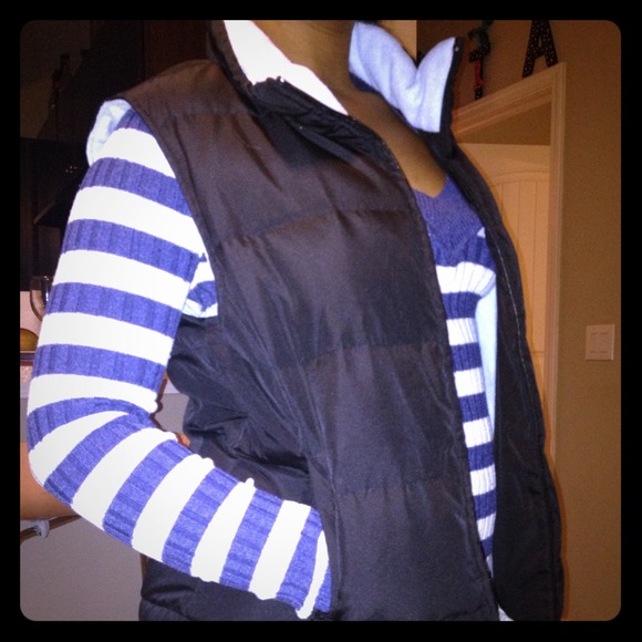 Black puffer vest with light blue lining