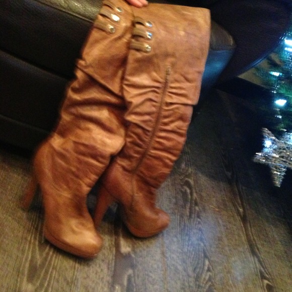 Jessica Simpson past the knee brown boots.