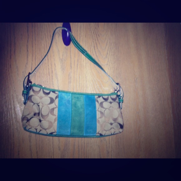 Coach signature fabric and suede details.
