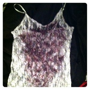 White lace cami with maroon design on front.