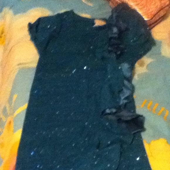 Teal colored shirt.
