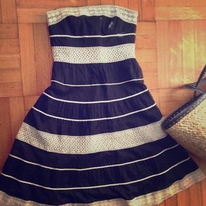 Black and cream colored crotchet dress.