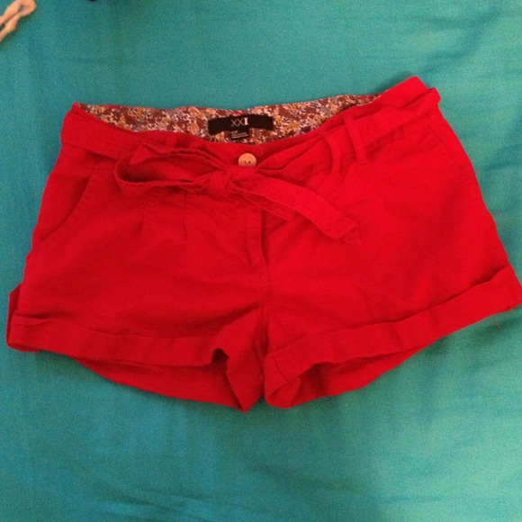 Red shorts with belt.