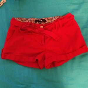 Red shorts with belt.