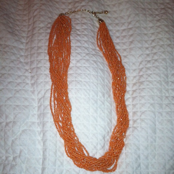 Peach beaded adjustable necklace.
