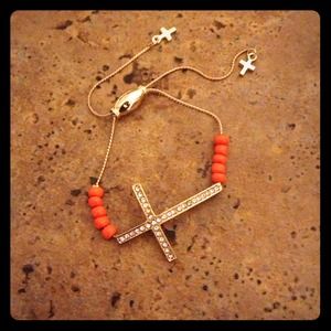 Cross bracelet with orange beads