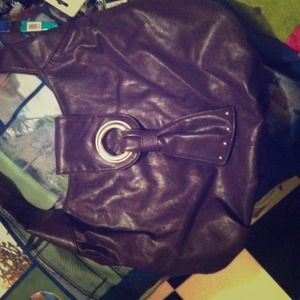 Cute leather purple purse with silver studs.