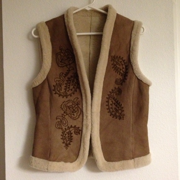 Almost new cozy brown vest with floral details