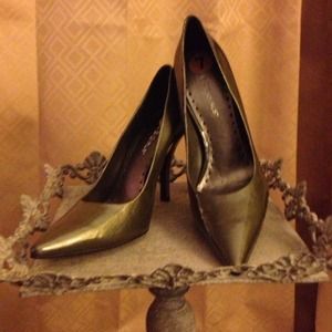 Metallic green BCBGirls pumps with unique heel.