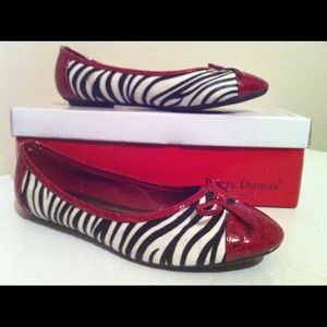 Zebra print with red accent flats