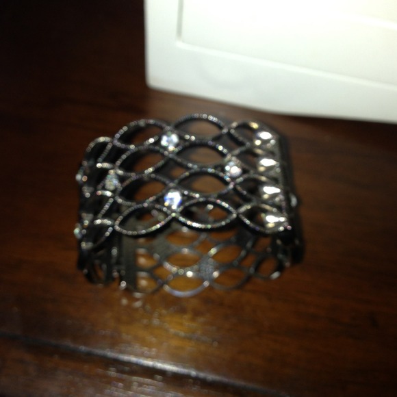 Cute bracelet. Pewter color with rhinestones.