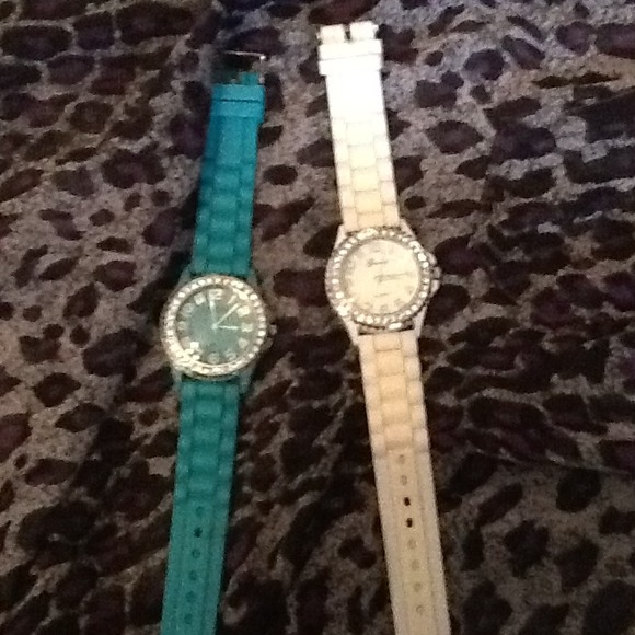 2 watches one is teal and the other is white. - Picture 1 of 1