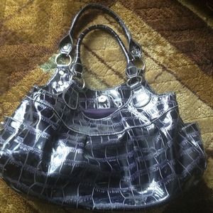 Purple sleek handbag