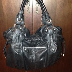 Black never used Jessica Simpson purse