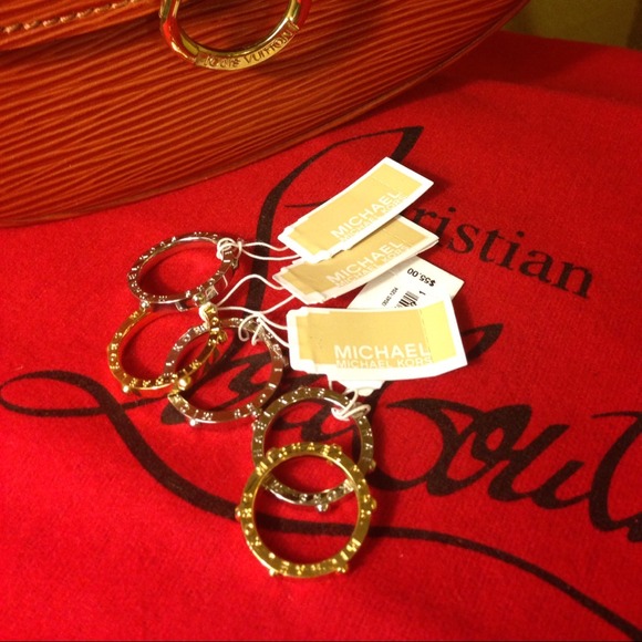 One Silver color Michael Kors Stud ring