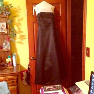 A black formal floor length dress.