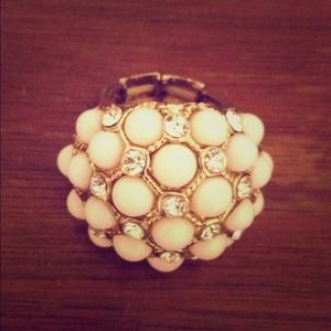 Reserved. White and rhinestone fashion ring