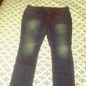 blue denim skinny jeans .