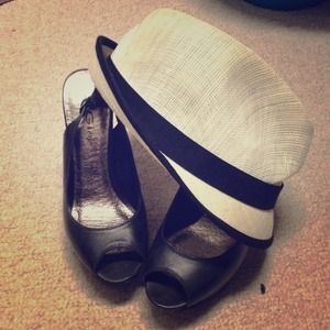 White straw hat with black ribbon