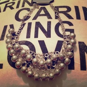 Silver bauble necklace.