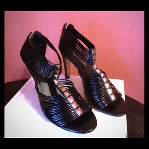 black with silver design, zipper in back