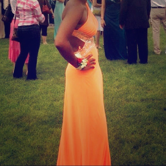 Orange floor length, one shoulder prom dress.