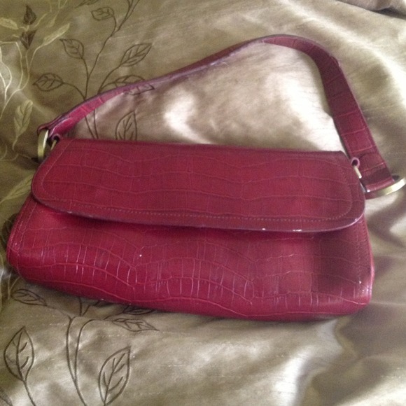 Maroon faux leather handbag.