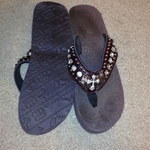 Cross with angel wing embellished wedge flip flops