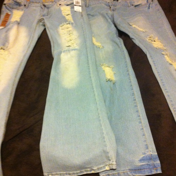 Two light wash ripped up jeans