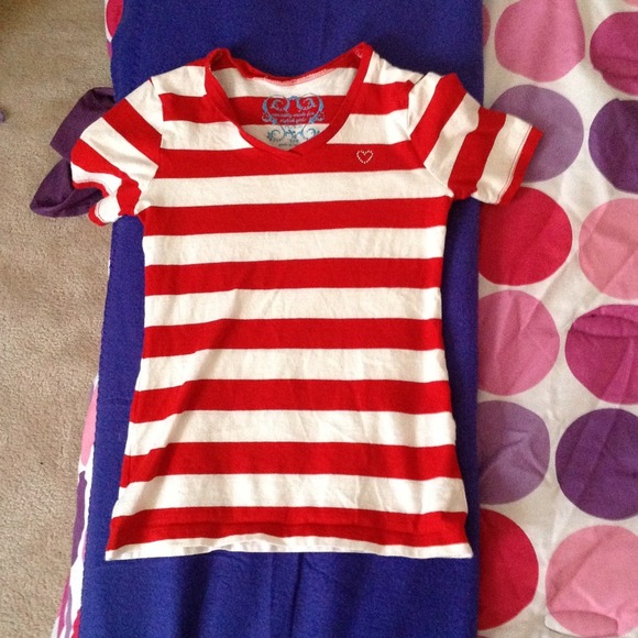 A red striped shirt,has a glittery heart on it.