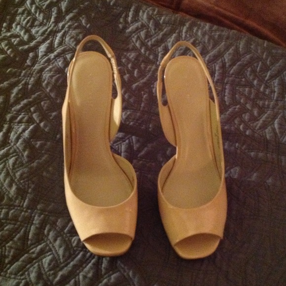Nine West ivory patent pumps.   DISCOUNTED Today!