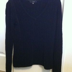 Black v-neck sweater.