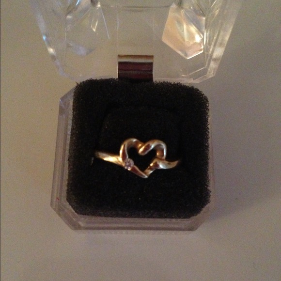 14 kt gold w/ tiny cut diamond.