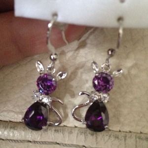 A pair of amethyst cat earrings