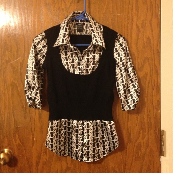 Cute top with a silky feel and attached sweater