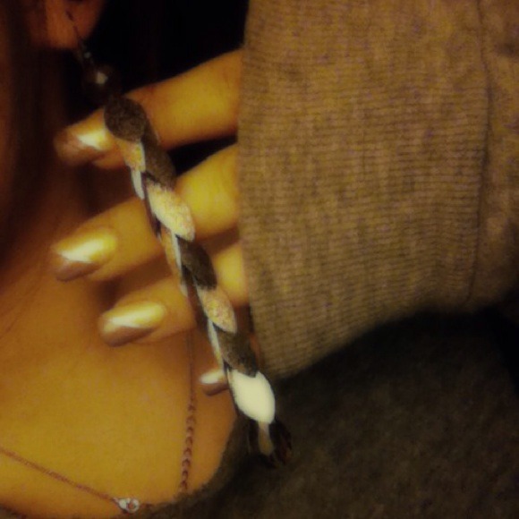 Dangling metallic earrings.