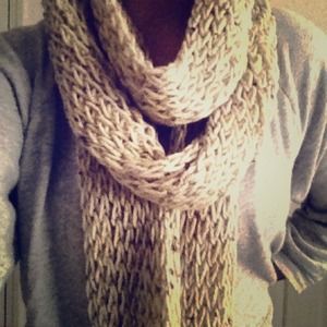 A beige knitted scarf