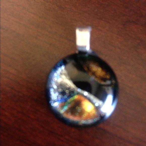 Beautiful small black, silver and gold pendant
