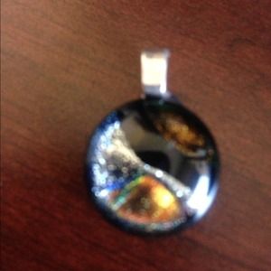 Beautiful small black, silver and gold pendant