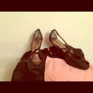 Black sequin shoes with ankle straps.