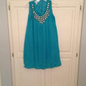 Teal colored dress with some blink