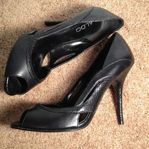 Aldo peep toe black pumps with faux snake trim.
