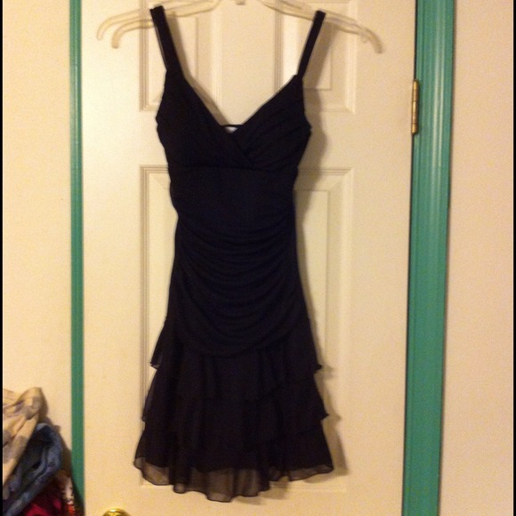 Worn once Black dress pretty with slimming effect.