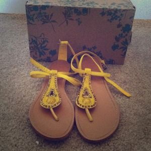 Yellow gladiator style sandals